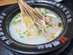 -明何记涮牛肚(品牌首店隋唐植物园南门古城路店)