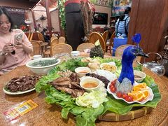 -沐毫傣泐云南菜孔雀宴•手抓饭傣味烧烤(曼听公园店)