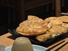 -明何记涮牛肚(品牌首店隋唐植物园南门古城路店)