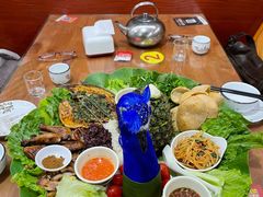 -沐毫傣泐云南菜孔雀宴•手抓饭傣味烧烤(曼听公园店)
