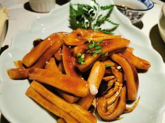 梭子蟹炒年糕-卯时·龙光雅宴·精致锡帮菜(惠山古镇店)