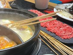 -明何记涮牛肚(品牌首店隋唐植物园南门古城路店)
