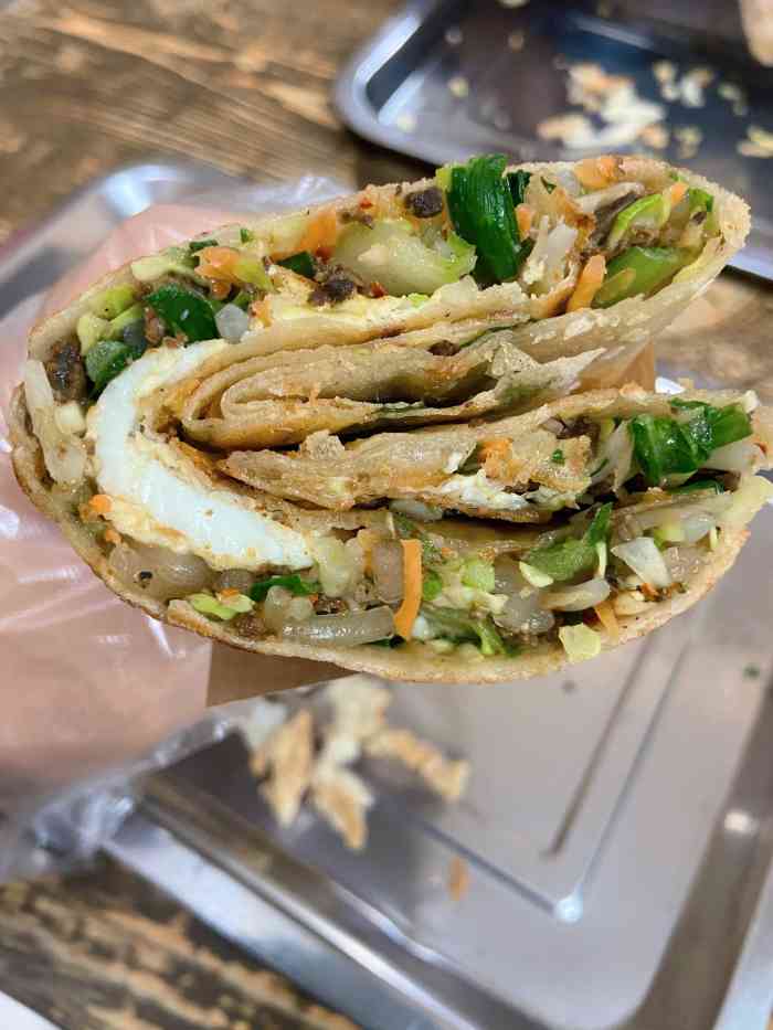 杨记塌煎饼-"*量很多,基本一份就能饱,填饱肚子是一点.