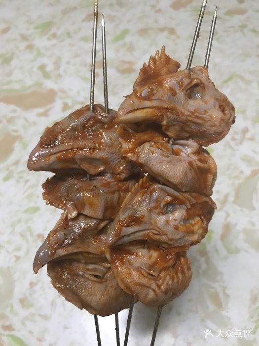 馋猫烧烤鸡头图片