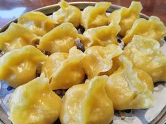 玉米面猪肉酸菜蒸饺-那家老院子东北菜·饺子·小鸡炖蘑菇(艳华街店)