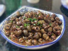 酱爆螺蛳-七的湖·晚芳亭·阳澄湖农家菜·大闸蟹(莲花岛店)
