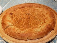 馕坑芝麻馕-巴扎美食·新疆菜·西域歌舞表演餐厅(新疆大厦店)