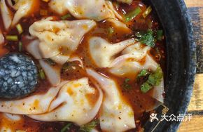 Signature Dumplings in Red Soup