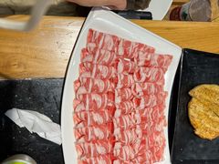 -明何记涮牛肚(品牌首店隋唐植物园南门古城路店)
